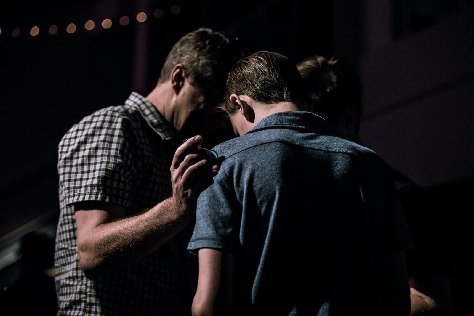 Two people embracing in a tender farewell moment